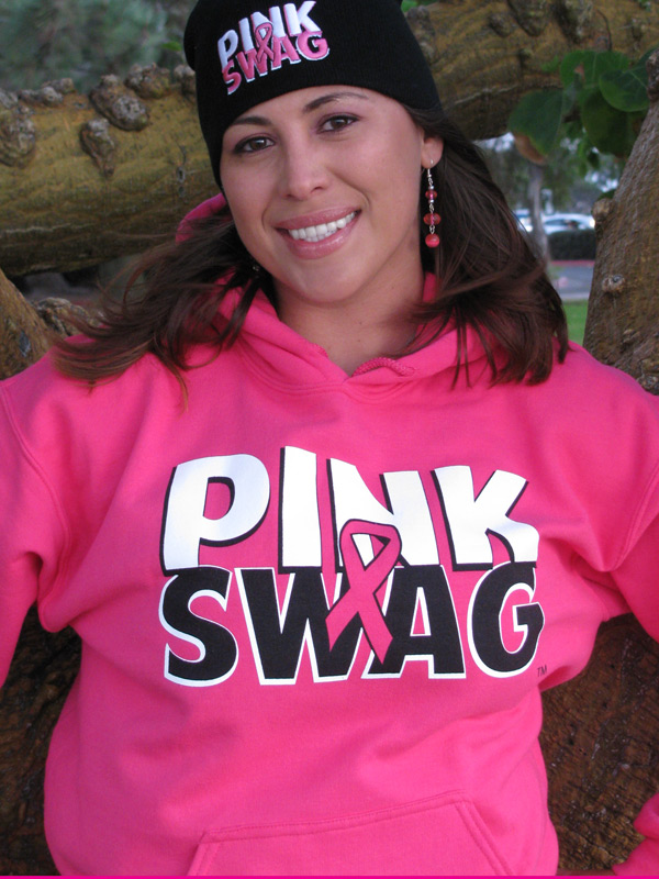 Ysabel smiling in her bright pink Pink Swag shirt and cap